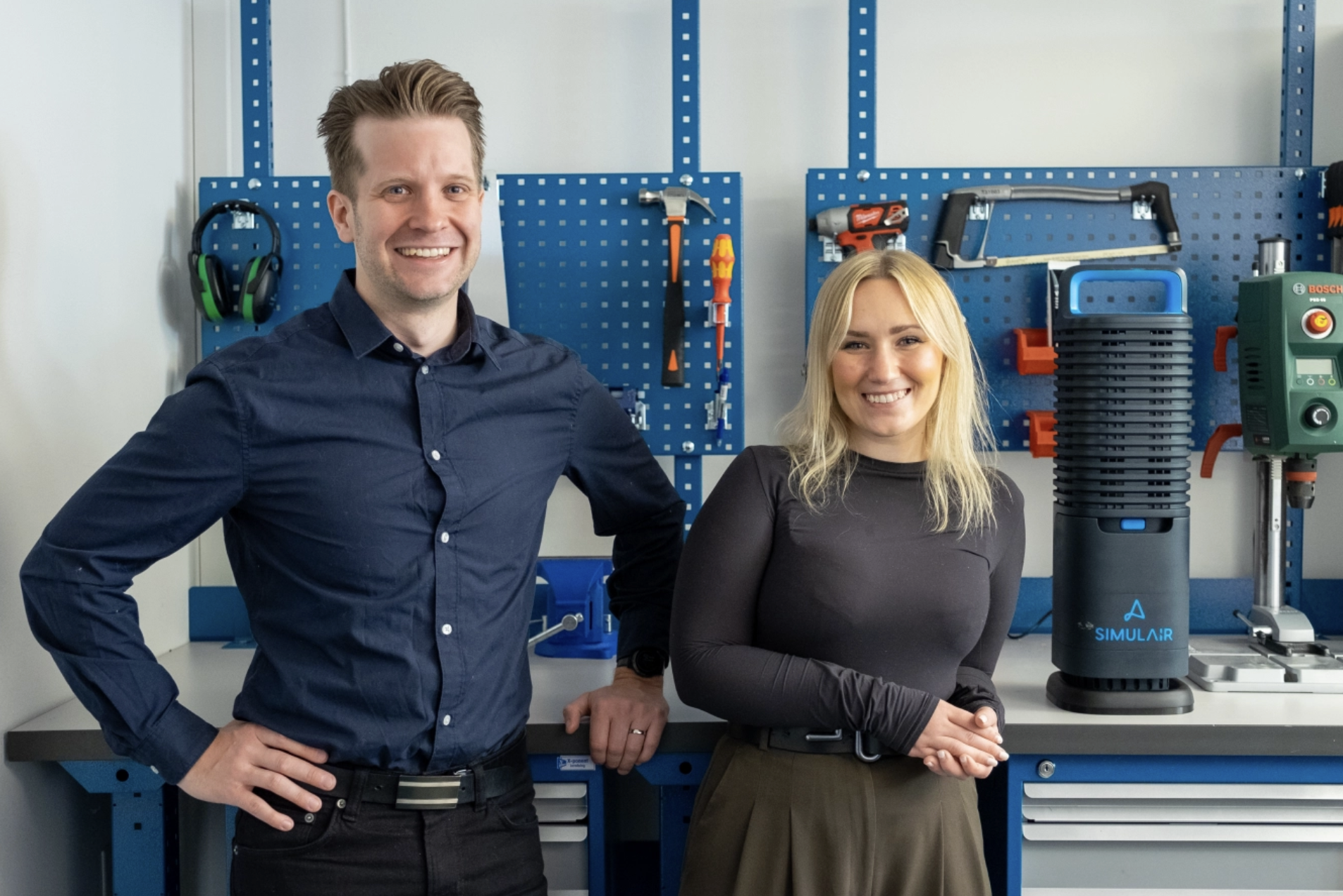 Photo of the Simulair founders next to their anti bed bug machine